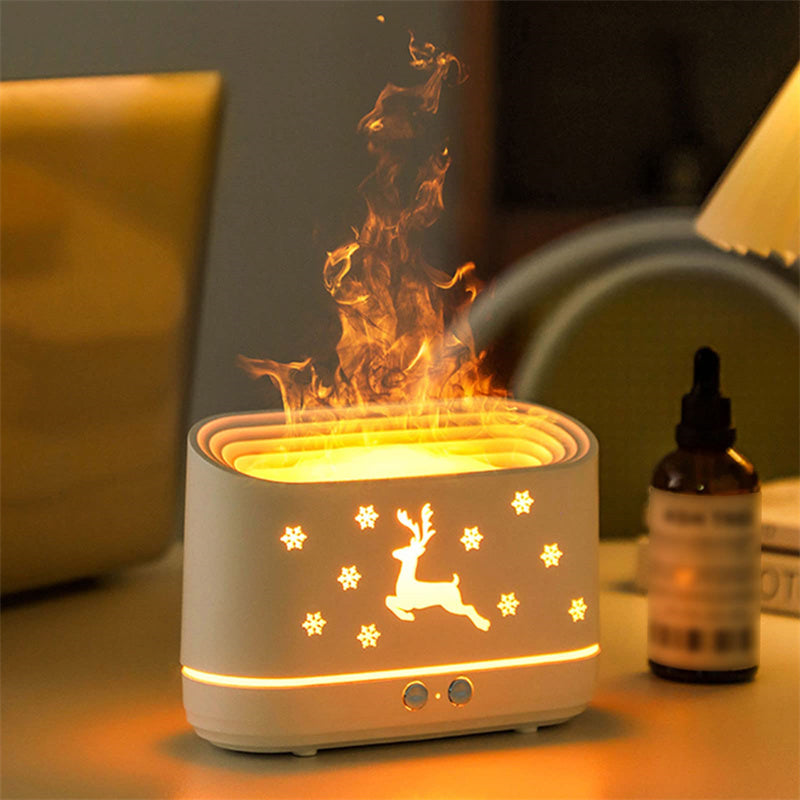 White tabletop humidifier with reindeer and snowflake cutouts emitting mist, warm ambient lighting