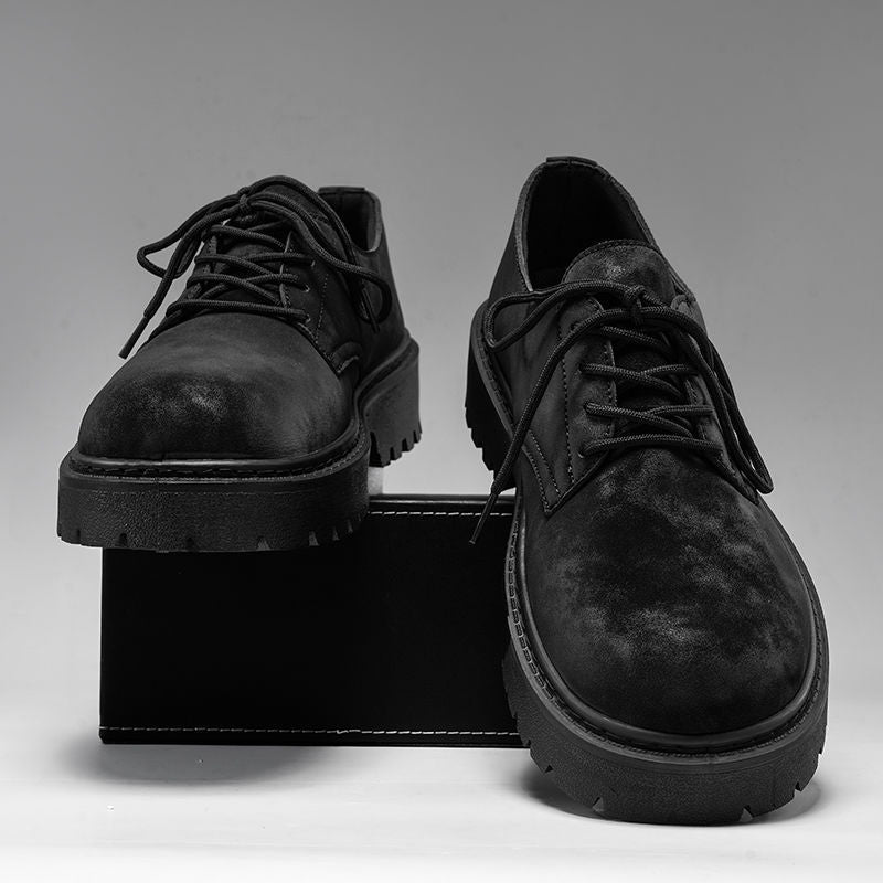 Black suede lace-up men's casual shoes with rugged rubber soles displayed on a black box