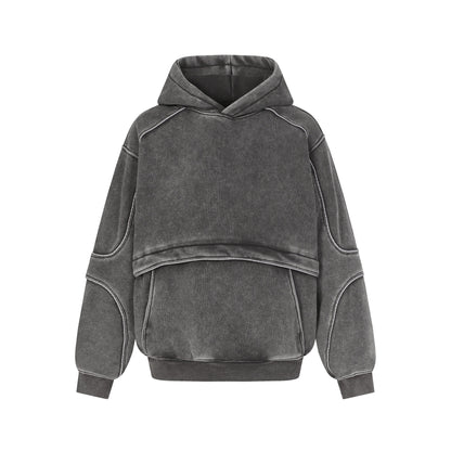Gray washed hoodie with layered design, padded elbow details, and ribbed cuffs
