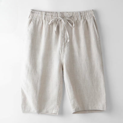 Beige casual linen shorts with elastic waistband and drawstring on white background