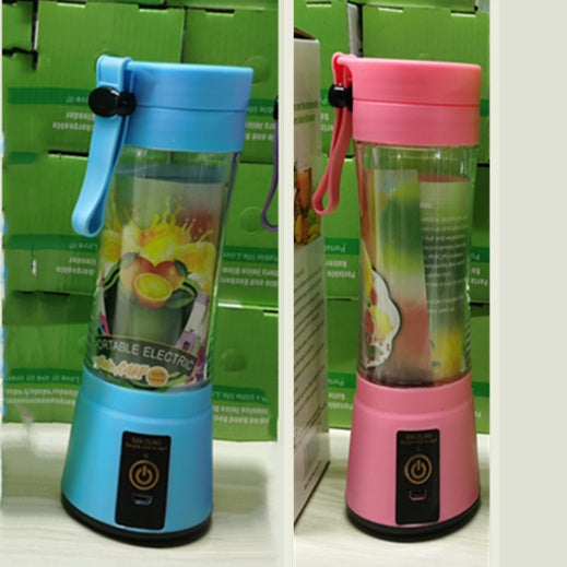 Portable electric blenders in blue and pink with fruit graphics, displayed against green boxes