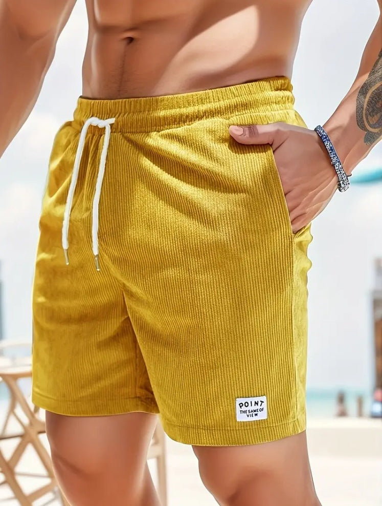 Men's yellow corduroy shorts with white drawstring and side pockets, casual summer wear