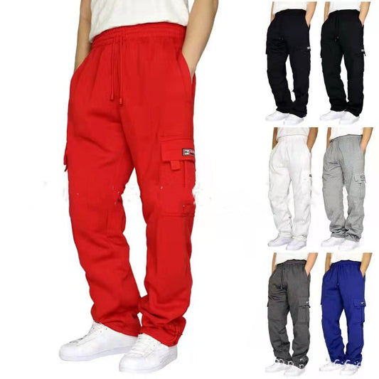 Men's casual cargo pants with side pockets in red, black, white, gray, charcoal, and blue with white sneakers
