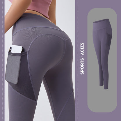 Women's purple workout leggings with high waist and side pocket holding phone, ideal for sports