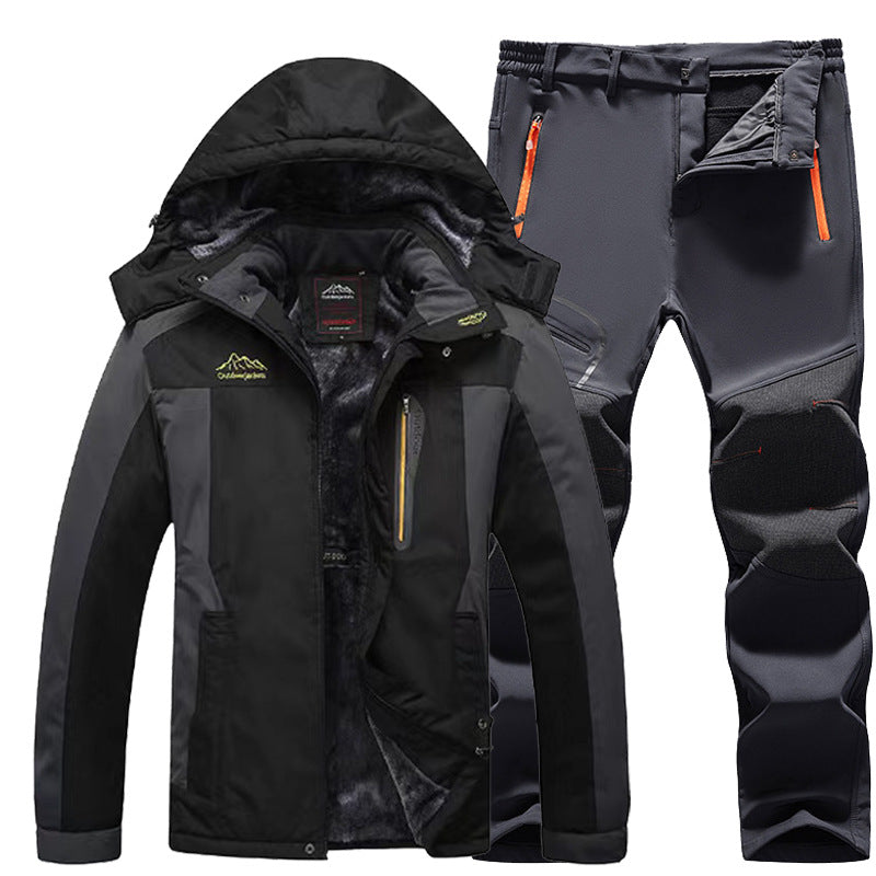 Black and gray waterproof outdoor jacket with hood and matching insulated hiking pants with orange zipper details