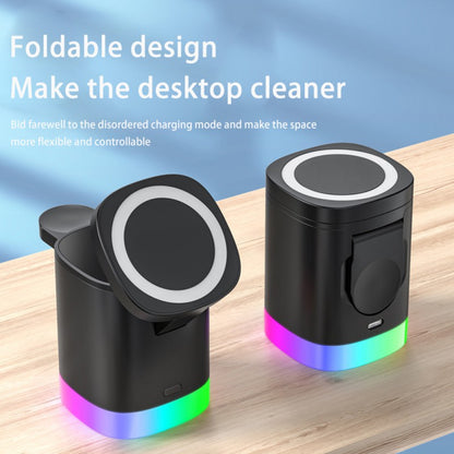 Foldable black wireless charger with LED base on wooden desk, promoting cleaner desktop design