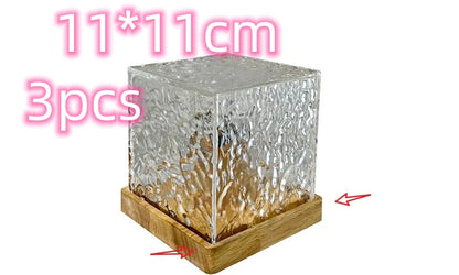 Set of three 11x11cm textured glass cube candle holders with wooden square bases