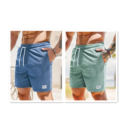 Men's casual corduroy shorts in blue and green with drawstrings and side pockets on muscular models