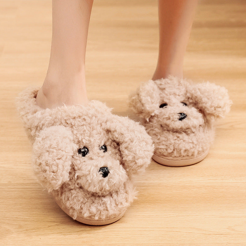 Cozy beige plush slippers with cute dog faces and floppy ears on wooden floor