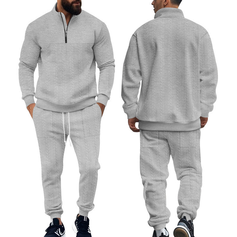 Men's light gray half-zip pullover and matching jogger sweatpants set with black sneakers
