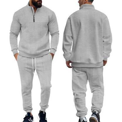 Men's light gray half-zip pullover and matching jogger sweatpants set with black sneakers