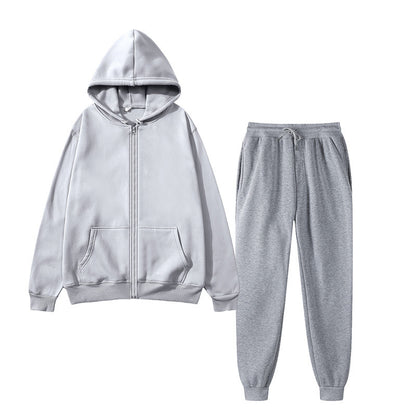 Light gray zip-up hoodie with kangaroo pockets and matching gray drawstring jogger pants