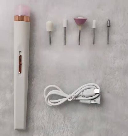 white electric nail drill pen with five polishing heads and USB charging cable on gray surface
