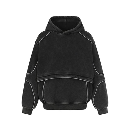 Black oversized hoodie with exposed white stitching and front kangaroo pocket
