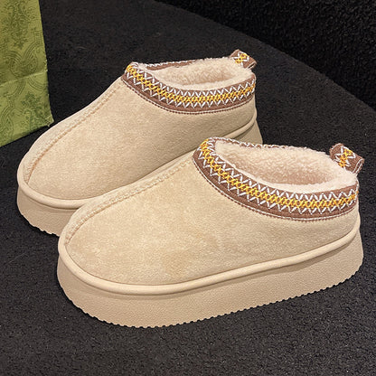 Beige indoor slippers with cozy fleece lining and decorative brown, yellow, and white stitching