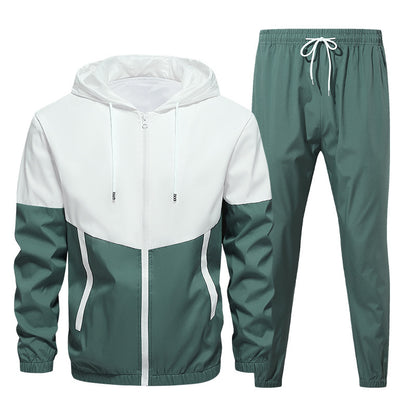 Two-tone men's tracksuit with white hooded jacket and green pants with elastic and drawstring waist
