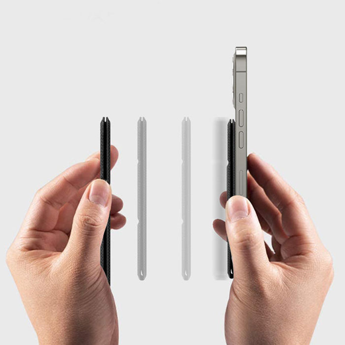 Hands holding ultra-thin black phone case and smartphone against light gray background