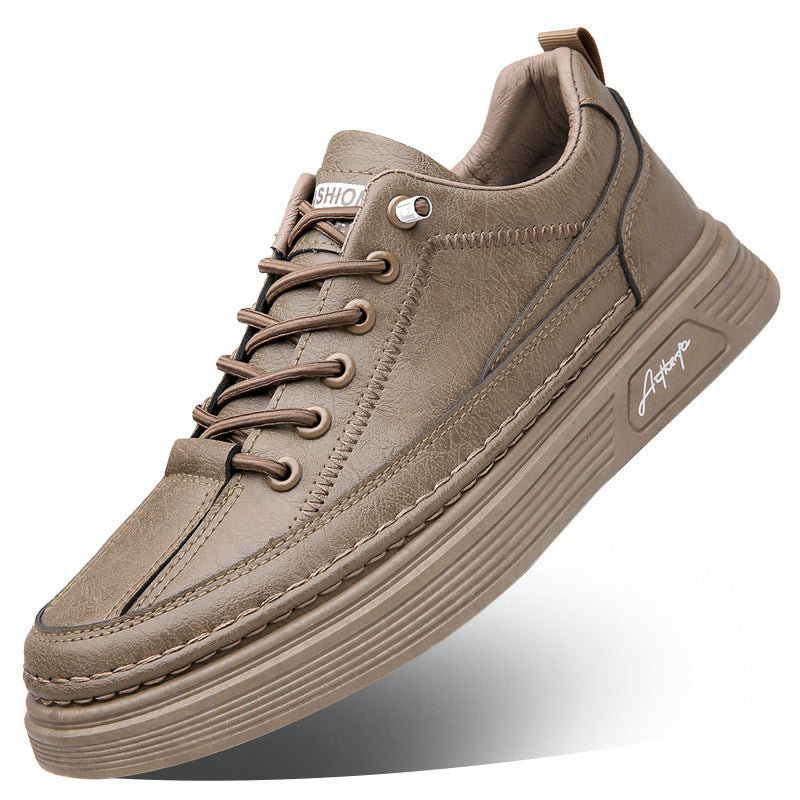 Stylish brown leather casual sneaker with stitching details and rubber sole on white background