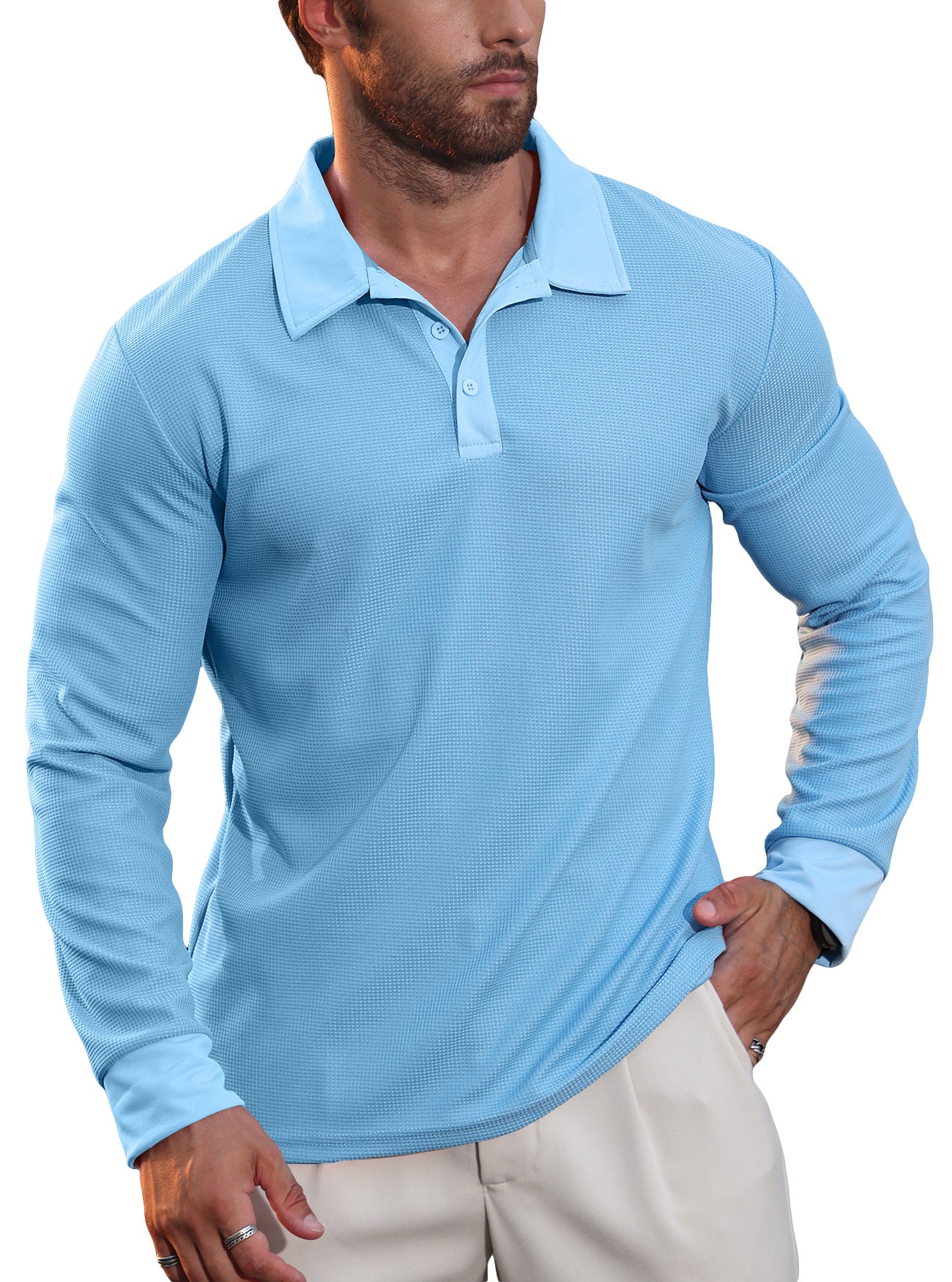 Man wearing a light blue long-sleeve polo shirt with textured fabric and beige pants