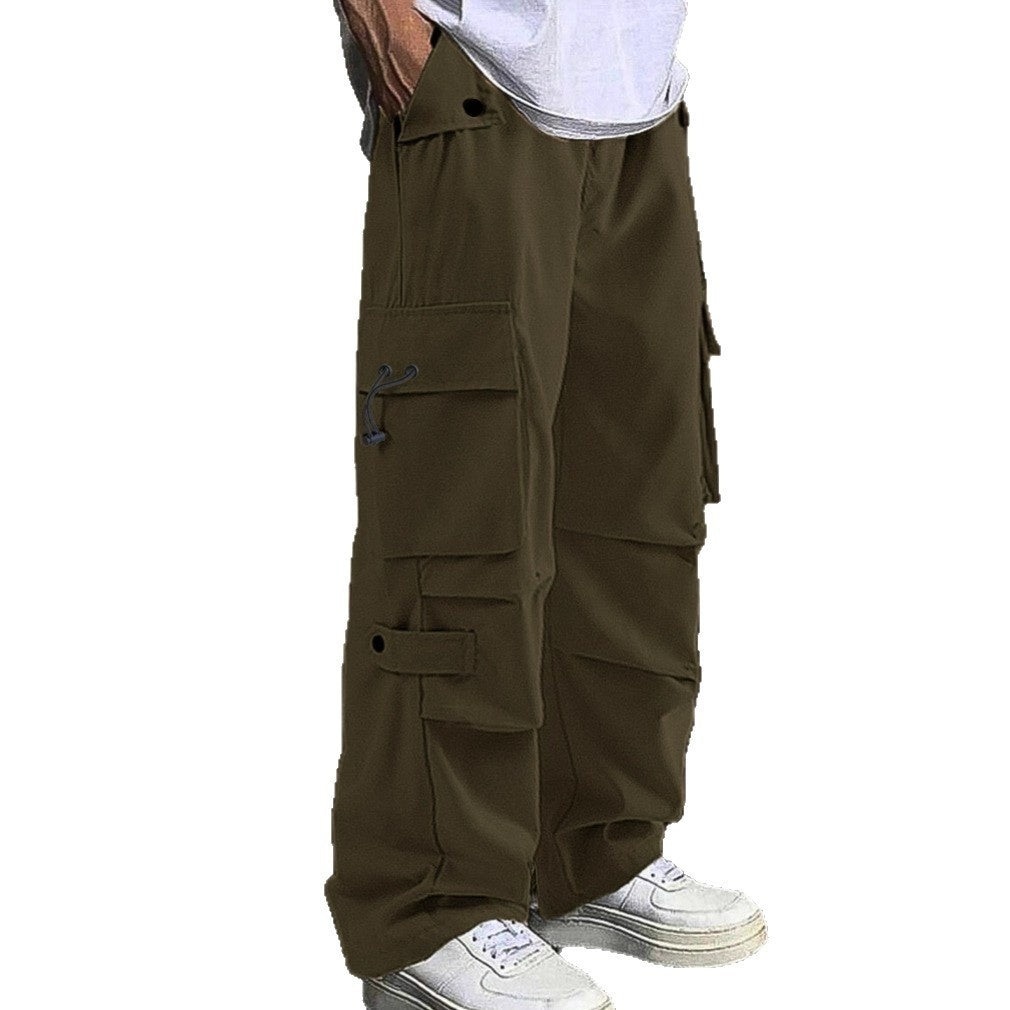 Men's casual brown cargo pants with flap pockets paired with white sneakers and white shirt