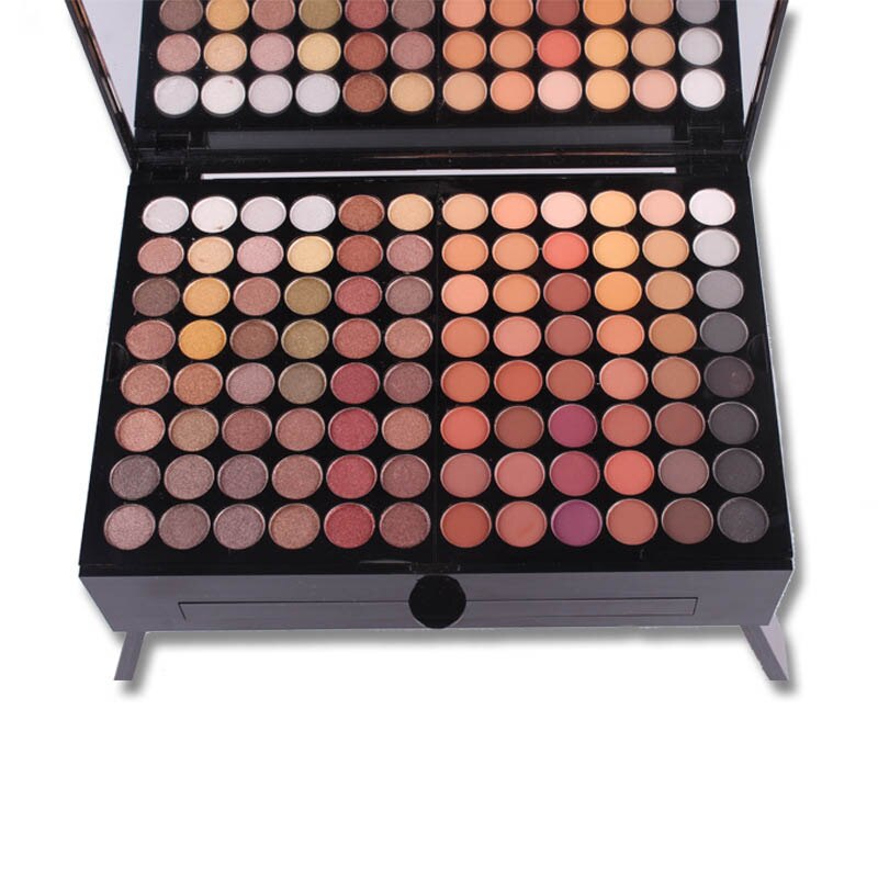 open makeup palette with varied eyeshadow and blush shades in warm and neutral tones with built-in mirror