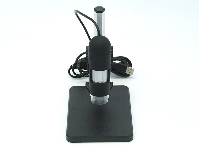 Digital USB microscope with black stand and coiled cable on white background
