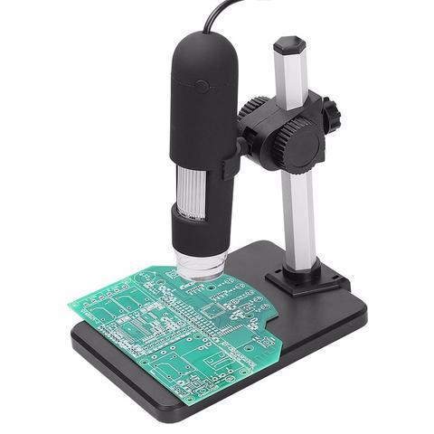Digital USB microscope with LED illumination and adjustable stand examining a green printed circuit board