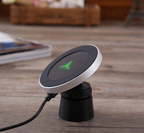 Trendoligy 10W magnetic wireless car charger mount with green LED on wooden surface