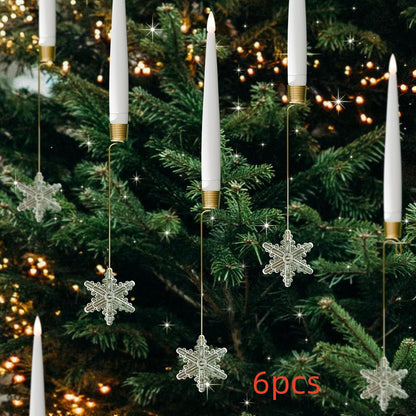 LED candle Christmas ornaments with hanging clear snowflake decorations on a green holiday tree