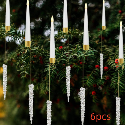 Christmas tree decorated with white LED candle ornaments and hanging crystal icicle decorations