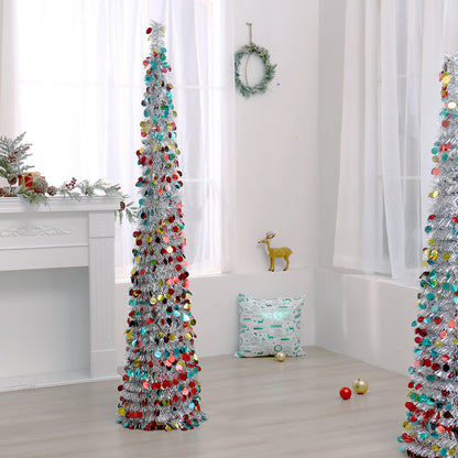 Tall slender silver Christmas tree decorated with multicolor shiny ornaments in bright modern room