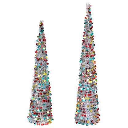 Tall slim silver Christmas trees decorated with colorful round confetti garlands