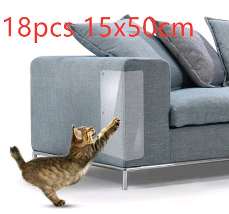 Clear PVC cat claw protector installed on blue sofa armrest with playful cat reaching up