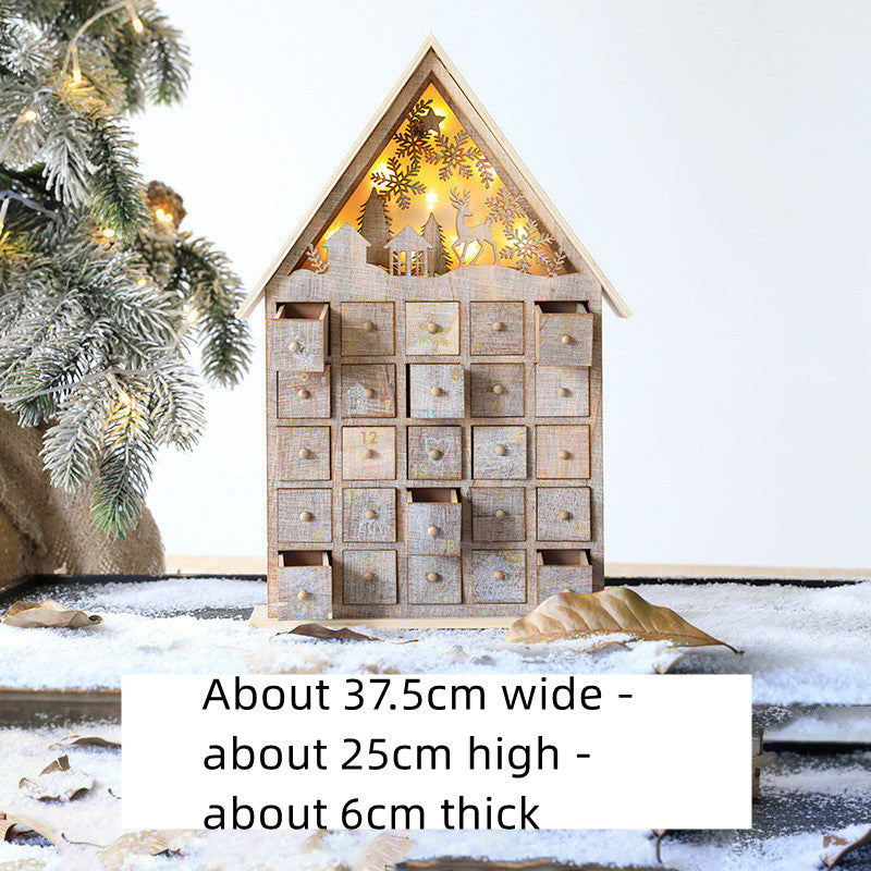 Wooden Christmas advent calendar with 24 numbered drawers and festive cutout lights