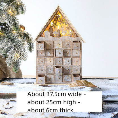 Wooden Christmas advent calendar with 24 numbered drawers and festive cutout lights