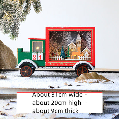 Wooden Christmas advent calendar shaped like a green and red truck with festive holiday scene and 'Merry Christmas' text