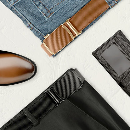 Brown and black leather ratchet belts displayed with brown shoe, blue jeans, black pants, and black leather wallet