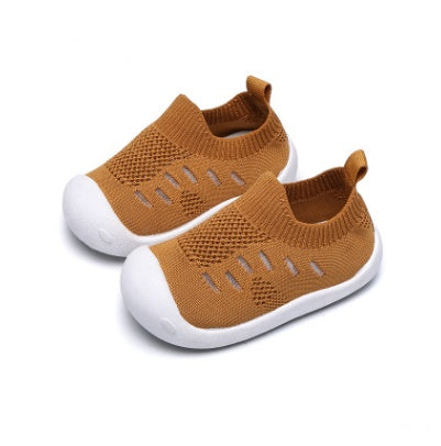 Brown toddler slip-on shoes with breathable knit fabric and white flexible soft soles