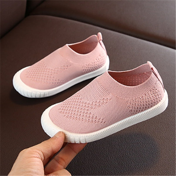 pink toddler slip-on shoes with breathable knit fabric and white flexible soft soles
