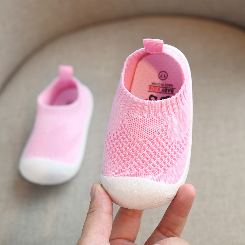 Pink toddler slip-on shoes with breathable knit design and white soft soles
