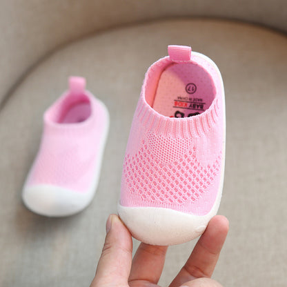 Pink toddler slip-on shoes with breathable knit design and white soft soles
