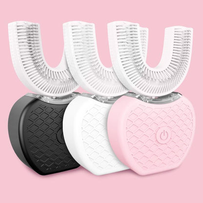 Three automatic U-shaped electric toothbrushes in black, white, and pink on a pink background