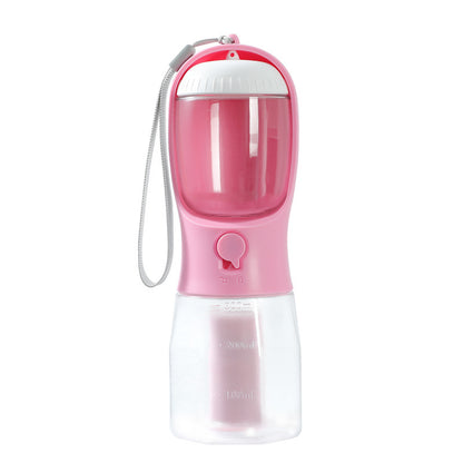 Pink portable pet water bottle with built-in water filter and waste bag dispenser on white background
