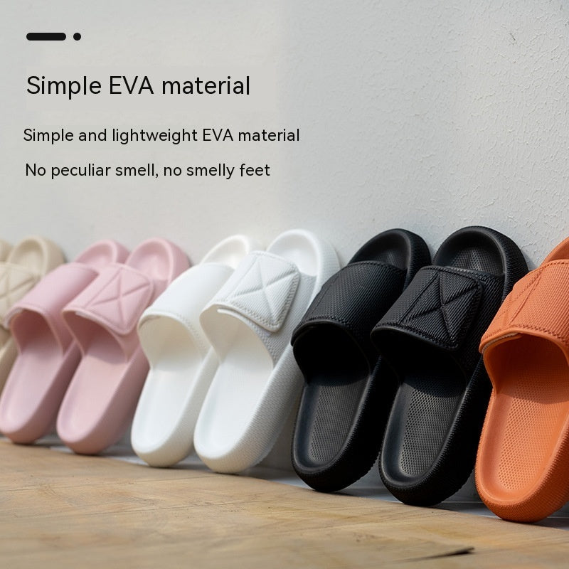 Row of black, white, pink, beige, and orange EVA platform slippers with cushioning comfort on wooden floor