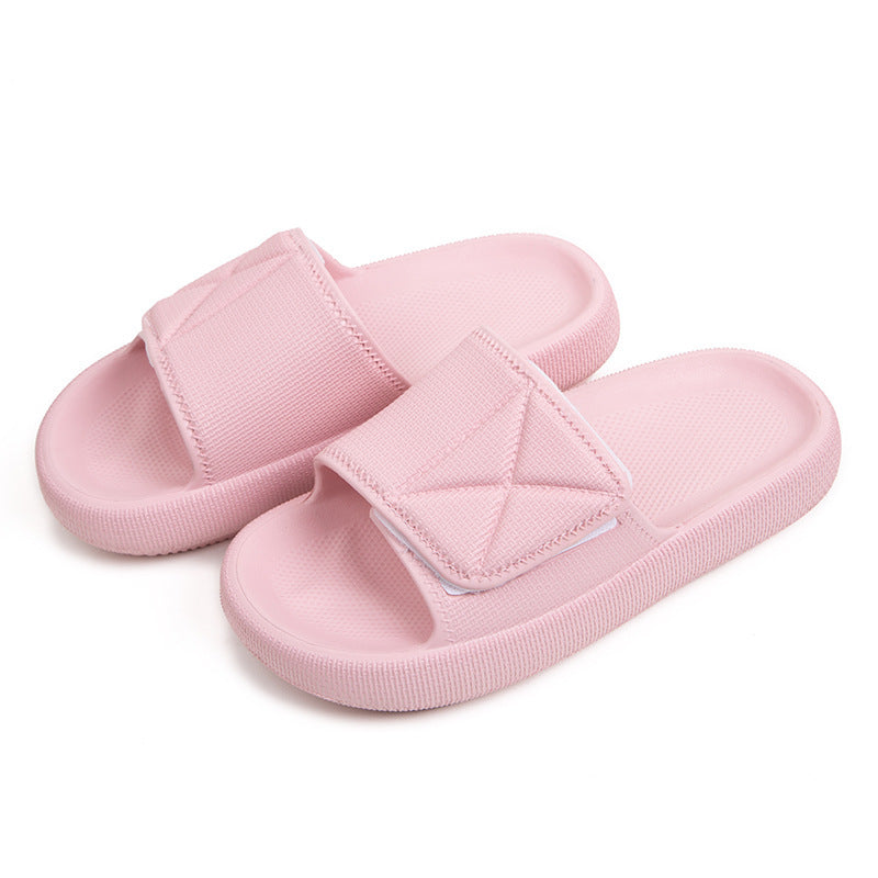 Pink EVA platform slippers with adjustable strap and cushioned sole on white background