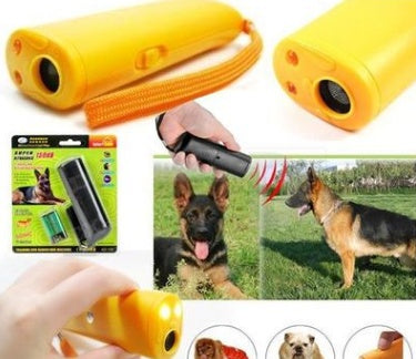 Yellow ultrasonic dog repeller with LED flashlight, handheld dog training device shown with German Shepherd outdoors