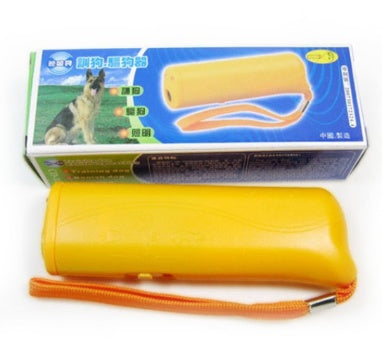 Yellow ultrasonic dog repeller device with orange wrist strap and packaging box featuring dog image