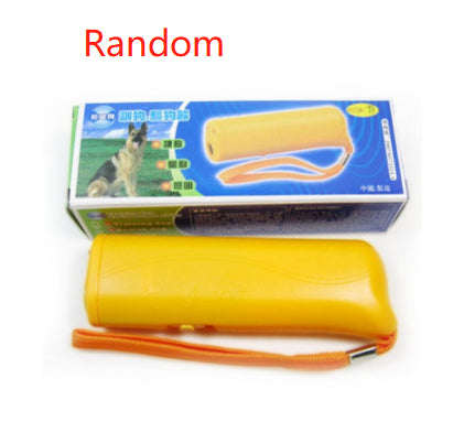 Yellow ultrasonic dog repeller with wrist strap and packaging featuring a German Shepherd image for humane dog training