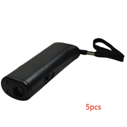 black ultrasonic dog repeller device with wrist strap against white background