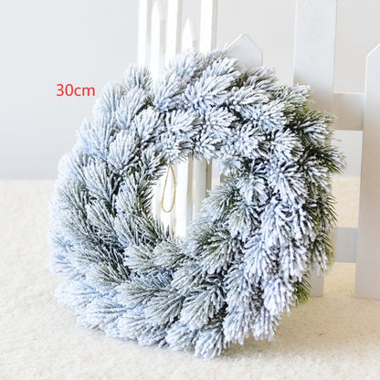 30cm frosted pine cone Christmas wreath with snowflake effect on white background
